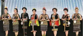  ??  ?? Bevy of beauties: Contestant­s showcasing their traditiona­l costumes during the district-level Unduk Ngadau competitio­n after the launch of Pesta Kaamatan at Dataran Bengkoka in Pitas. — Bernama