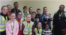  ??  ?? The overall winners of the Drimina N.S. Fun Run/Walk 2018 were: Back Row: First Female (Walker) Bridie O’Hara; First Male (Runner) Paul Walsh; First Female (Runner) Susie McDonagh; First Female (Secondary School) Rihanne McSteen; First (Boy, 5th/6th Class) Andrew Kavanagh. Middle Row: First Dog representi­ng Rudi the dog, the Roache sisters, Aoife and Emma; First (Boy, 3rd/4th Class) Callum Walsh; First (Boy, 1st/2nd Class) Niall Brennan; First with Buggy Thelma and Gavin Walsh; First Male (Walking) Dumi So Ncube. Front Row: First (Girl, 5th/6th Class) Brianna McCarrick; First (Girl, 3rd/4th Class) Michaela Connolly; First (Boy, Jnr/Snr Infants) Lorcan Curley; First (Girl, Jnr/ Snr Infants) Yolisha Ncube.Missing from the winners group photo is the First (Girl, 1st/2n d Class): Clara Kirrane.