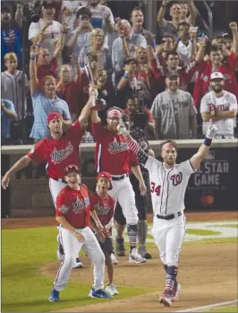  ?? The Associated Press ?? Washington Nationals’ Bryce Harper reacts to his final home run to win Monday’s MLB Home Run Derby. Harper finished with 19 homers over three rounds.