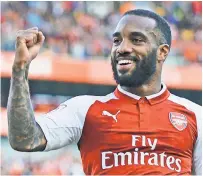  ??  ?? STRIKE IT RICH: Alexandre Lacazette (above) is now with Arsenal, signing a $63 million deal, while Manchester City’s Kevin De Bruyne (left) can’t fault the large amounts of money being paid, including to five new teammates, saying, “It’s how the market...