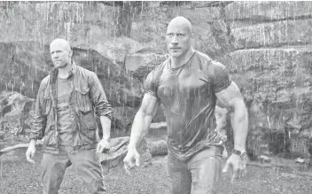  ?? — Courtesy of Universal Pictures ?? Johnson, right, and Statham are mismatched partners in the action spinoff ‘Fast & Furious Presents: Hobbs & Shaw’.