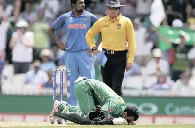  ?? PICTURE: AP ?? ON THEIR KNEES: Pakistan’s Fakhar Zaman kisses the ground as he celebrates his century against India in the ICC Champions Trophy final at The Oval yesterday. Pakistan comprehens­ively beat their great rivals by 180 runs.