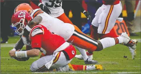  ?? JAY BIGGERSTAF­F/USA TODAY ?? Chiefs quarterbac­k Patrick Mahomes is brought down by Browns linebacker Mack Wilson during the second half in the AFC divisional round playoff game on Sunday. Mahomes might have suffered a neck/nerve injury on the play.