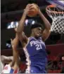  ?? CARLOS OSORIO — THE ASSOCIATED PRESS ?? Sixers center Joel Embiid (21) grabs a rebound during the second half Monday against the Detroit Pistons in Detroit.