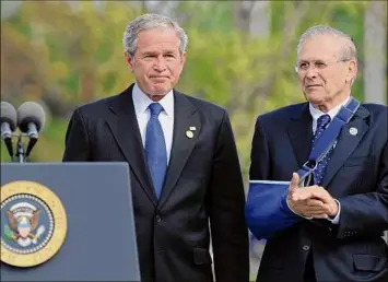  ?? Susan Walsh / Associated Press ?? Former Defense Secretary Donald Rumsfeld stands with President George W. Bush in 2008 during a memorial ceremony at the Pentagon, marking the seventh anniversar­y of the Sept. 11. Rumsfeld is the only person to serve twice as Pentagon chief.