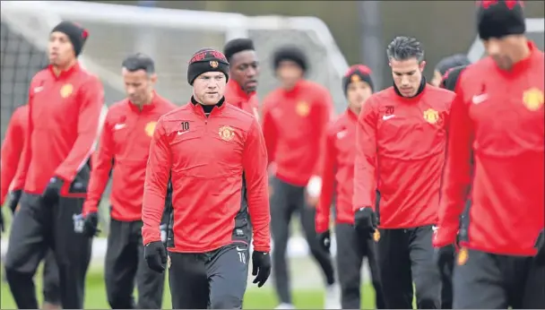  ?? Picture: PA. ?? Rooney, Van Persie and other members of the Manchester United squad at training at the AON complex yesterday.