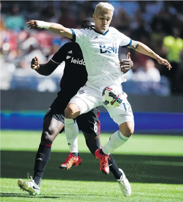  ?? GERRY KAHRMANN/PNG FILES ?? Whitecaps striker Fredy Montero, in white, played well against DC United but couldn’t find the range in a 1-0 loss.