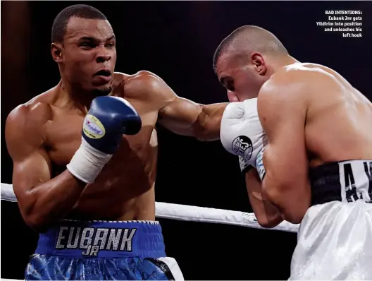  ?? Photos: ACTION IMAGES/ANDREW COULDRIDGE ?? BAD INTENTIONS: Eubank Jnr gets Yildirim into position and unleashes his left hook