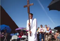  ??  ?? A procession from St. Anthony’s Parish heads to the front of the Pecos Pueblo mission church Sunday during the annual Fiesta de Nuestra Señora de los Ángeles. The event brings together descendant­s of the pueblo, inhabitant­s of nearby villages and...