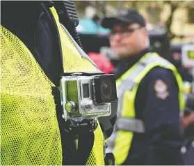  ?? JONATHAN HAYWARD / THE CANADIAN PRESS FILES ?? A study published last year concludes that the wearing of body cameras by police officers has had statistica­lly insignific­ant effect on police and citizen behaviour.