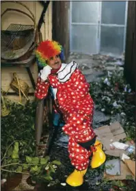  ??  ?? Abdelsalam poses for a photo in a flower shop before performing.