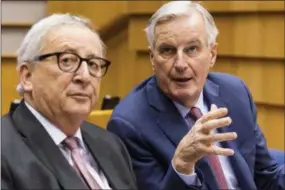  ?? GEERT VANDEN WIJNGAERT—ASSOCIATED PRESS ?? EU Commission President Jean Claude Juncker, left, and European Union chief Brexit negotiator Michel Barnier talk during a plenary session at the European Parliament in Brussels on Wednesday Jan. 30, 2019. Leaders across the European Union offered a united chorus of “No” on Wednesday to Britain’s belated bid to negotiate changes to the Brexit divorce deal so Prime Minister Theresa May can win the backing of her Parliament.