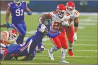  ?? The Associated Press ?? RUNAWAY ROOKIE: Kansas City Chiefs running back Clyde Edwards-Helaire, right, runs the ball during the first half of Monday’s game against the Buffalo Bills in Orchard Park, N.Y.