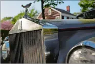  ?? VICTOR J. BLUE/BLOOMBERG ?? The ‘Spirit of Ecstasy’ hood ornament is seen on the hood of a 1959 Rolls-Royce parked on a street in Sag Harbor.