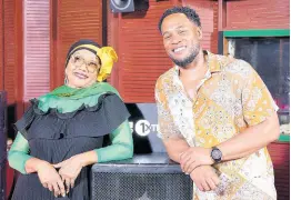  ?? ?? A smiling Reggae Queen Marcia Griffiths proudly wears her black, green and gold as she poses with BBC 1 Extra boss, Faron McKenzie.