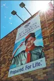  ?? GEORGE FREY / GETTY IMAGES VIA AFP ?? A sign is hung on the outside of the headquarte­rs of the Utah National Park Council of the Boy Scouts of America in Orem, Utah, on May 9.