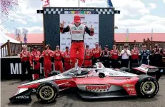  ?? AP ?? New Zealand’s Scott McLaughlin celebrates in Victory Circle after his win in an IndyCar auto race at Mid-Ohio Sports Car Course in Lexington, Ohio.