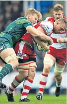  ??  ?? Good to be back: Josh Mcnally (left) tackles Gloucester’s Ruan Ackermann