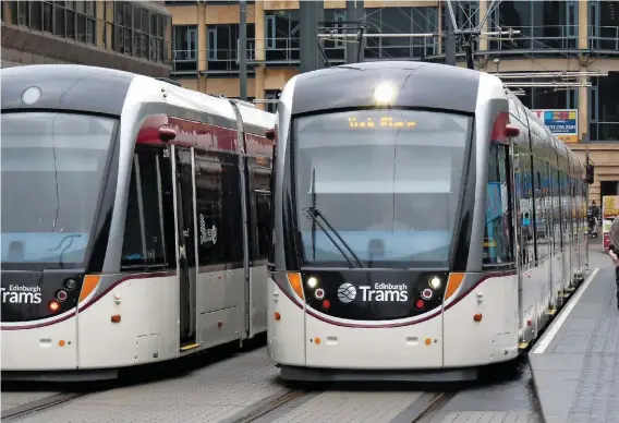  ?? RICHARD CLINNICK. ?? Trams 275 and 266 pass at Haymarket on June 5 2014. The existing fleet of Edinburgh Trams is already sufficient to cope with the planned extension.