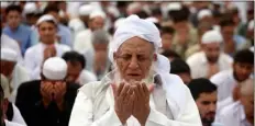  ??  ?? Pakistani faithful offer Eid al-Fitr prayers to celebrate the end of the holy month of Ramadan in Peshawar, Pakistan AP Photo/MuhAMMAd SAJJAd