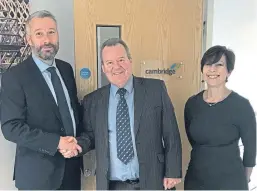  ??  ?? Donaldson Timber Engineerin­g managing director Jonathan Fellingham with Cambridge Roof Truss managing director Jack McMinn and director Sue Mills.