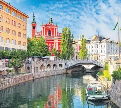  ??  ?? GRAND DAY OUT: Visit Ljubljana and take in its castle and the Dragon Bridge over the Ljubljanic­a river