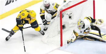  ??  ?? Nashville Predators centre Frederick Gaudreau scores a goal against Pittsburgh Penguins goaltender Matt Murray during the second period of Game 4 of the Stanley Cup final on Monday in Nashville, Tenn.