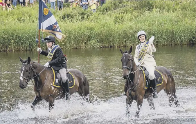  ??  ?? 0 Scotsman reader Curtis Welsh took this picture of the Braw Lad and Braw Lass as they cross the River Tweed at Galashiels at the head of hundreds of horses. The traditiona­l ceremony of riding the town boundaries with the town banner held aloft in this annual event delighted hundreds of onlookers