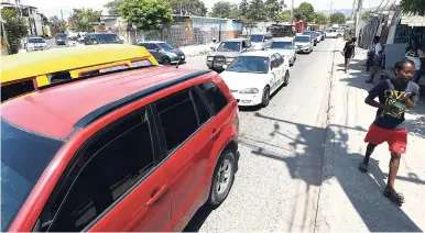  ?? RICARDO MAKYN/MULTIMEDIA PHOTO EDITOR ?? Vehicles in a traffic jam on Olympic Way yesterday.