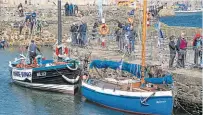  ?? PHOTO: ALLAN ROBERTSON ?? Boats and visitors at a previous festival, showing White Wing moored in the harbour.