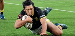  ??  ?? Thomas Umaga-Jensen joined the tryscoring party with this effort as Wellington, after an almighty struggle, earned promotion back to the premiershi­p for 2018.