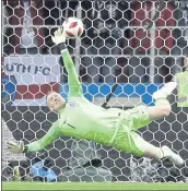  ?? MATTHIAS SCHRADER — THE ASSOCIATED PRESS ?? England goalkeeper Jordan Pickford makes a save on a penalty kick in Tuesday’s World Cup match vs. Colombia.