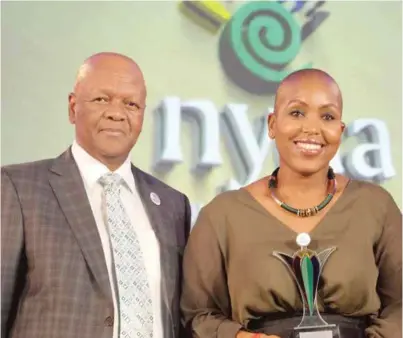  ??  ?? Nneile Nkholise won the Presidenti­al Award from Minister Jeff Radebe