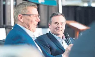  ?? MICHAEL BELL THE CANADIAN PRESS FILE PHOTO ?? Much like Jason Kenney, right, in Alberta, Saskatchew­an’s Scott Moe has tried to appeal to a certain base of support — many of whom are against health restrictio­ns and vaccine passports.