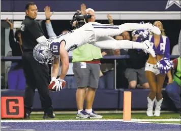  ?? RON JENKINS — THE ASSOCIATED PRESS ?? Dallas’ Ryan Switzer leaps into the end zone while returning a Washington punt for a touchdown in the second quarter.
