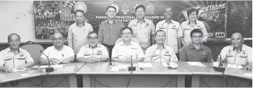  ??  ?? Lo (seated, centre) with Ahmad on his left, Rangen (seated, second right) and other MPP officials and staff in a photo-call after the press conference.
