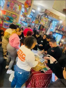  ?? COURTESY UTEC ?? Young women in UTEC programmin­g celebrated Women’s History Month by creating a mural at Downtown Lowell’s Flipflop Vintage.