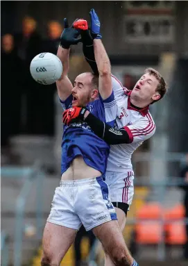  ?? OLIVER MCVEIGH/SPORTSFILE ?? Xyyyyy xyyyy xyyyy xxxxx yyyy Slaughtnei­l’s Brendan Rodgers punches the ball clear of Cavan Gaels’ Paul O’Connor during yesterday’s Ulster final