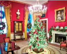  ??  ?? The Red Room salutes America’s first responders and front-line workers, who have been critical during this pandemic. The tree decoration­s and mantel display highlight this theme.
