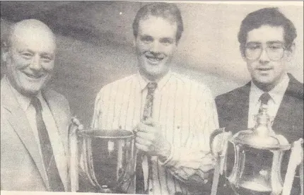  ??  ?? No mystery to the above picture. County board chairman of the time Jimmy Dunne with Kenneth O’Neill, Arklow Geraldines team captain and Felix Kavanagh, club chairman at the Arklow Geraldines annual dinner dance where they were celebratin­g winning the...