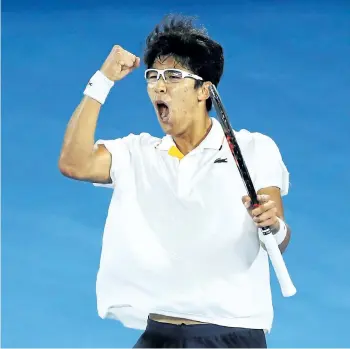  ?? MARK KOLBE/GETTY IMAGES ?? Hyeon Chung celebrates a point in his fourth-round upset victory over Novak Djokovic on Monday at the Australian Open in Melbourne, Australia. Chung, ranked 58th in the world, is the first Korean to reach the quarter-finals at a Grand Slam.