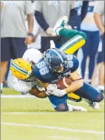  ?? Canadian Press photo ?? Toronto Argonauts' Jimmy Ralph catches a pass against the Edmonton Eskimos during the first half of CFL football action in Toronto, Friday.