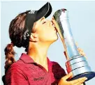  ?? — Reuters photo ?? Hall celebrates winning the Women’s British Open with the trophy.