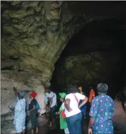  ??  ?? Tourists inside the Ihuezi Cave writing their names on the walls as an indication that they visited the cave