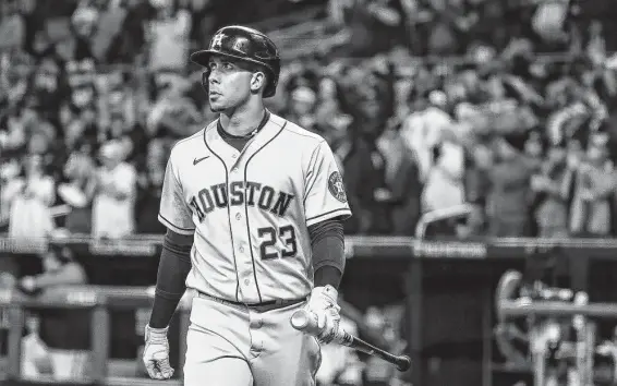  ?? Karen Warren / Staff photograph­er ?? The Astros’ Michael Brantley walks back to the dugout after striking out in the top of the ninth inning of Game 4 on Saturday night at Truist Park.