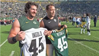  ?? MARK HOFFMAN / MILWAUKEE JOURNAL SENTINEL ?? Green Bay Packers fullback Danny Vitale (left) and Oakland’s Alec Ingold exchange jerseys after the game Sunday.