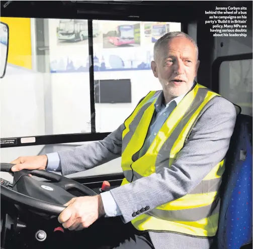  ??  ?? Jeremy Corbyn sits behind the wheel of a busas he campaigns on his party’s ‘Build it in Britain’policy. Many MPs are having serious doubtsabou­t his leadership