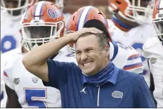  ?? AP file photo ?? Florida coach Dan Mullen reacts during the second half of the Gators’ win over Ole Miss on Sept. 26. The No. 10 Gators paused all team activities Tuesday following “an increase in positive COVID tests among players.”