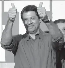  ?? ANDRE PENNER/AP ?? Fernando Haddad, Sao Paulo’s mayor-elect, celebrates after winning the election in South America’s biggest city.