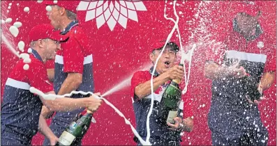  ?? ?? The United States celebrate their Ryder Cup success – F1 style – at Whistling Straits last Sunday